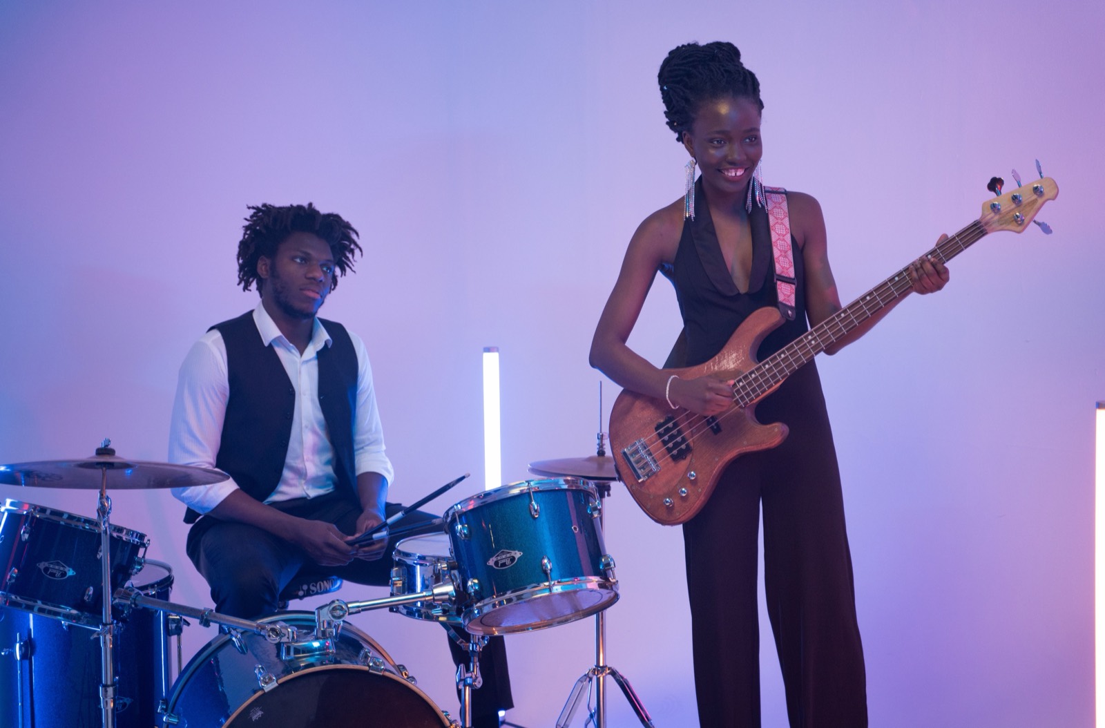 Two members jamming — drums and bass
